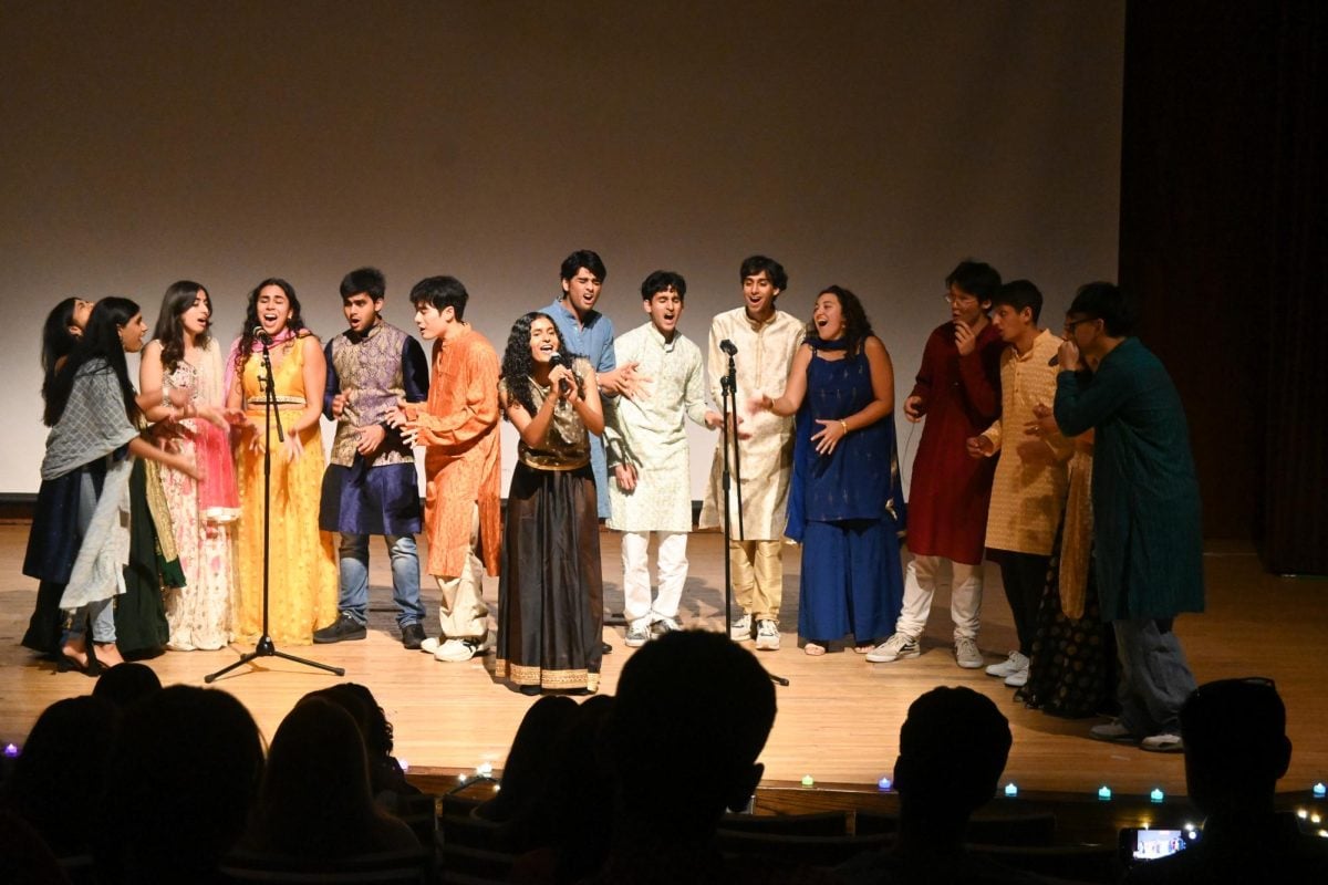 A capella group Brown Sugar performs onstage. 
