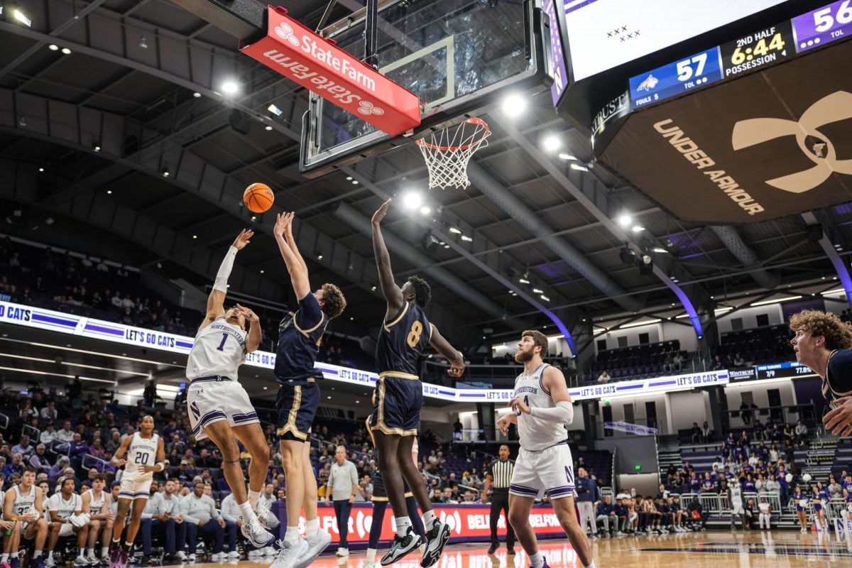 Graduate student guard Jalen Leach tries to convert an acrobatic shot against Montana State earlier this season. 