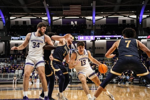 Senior guard Brooks Barnhizer drives to the paint against Montana State Tuesday. Barnhizer made his season debut in the 72-69 Northwestern win. 