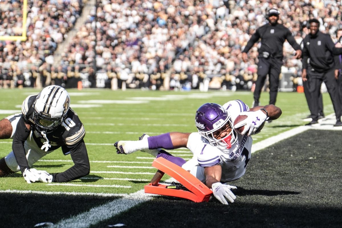 Graduate student running back Cam Porter dives for the pylon against Purdue Saturday.