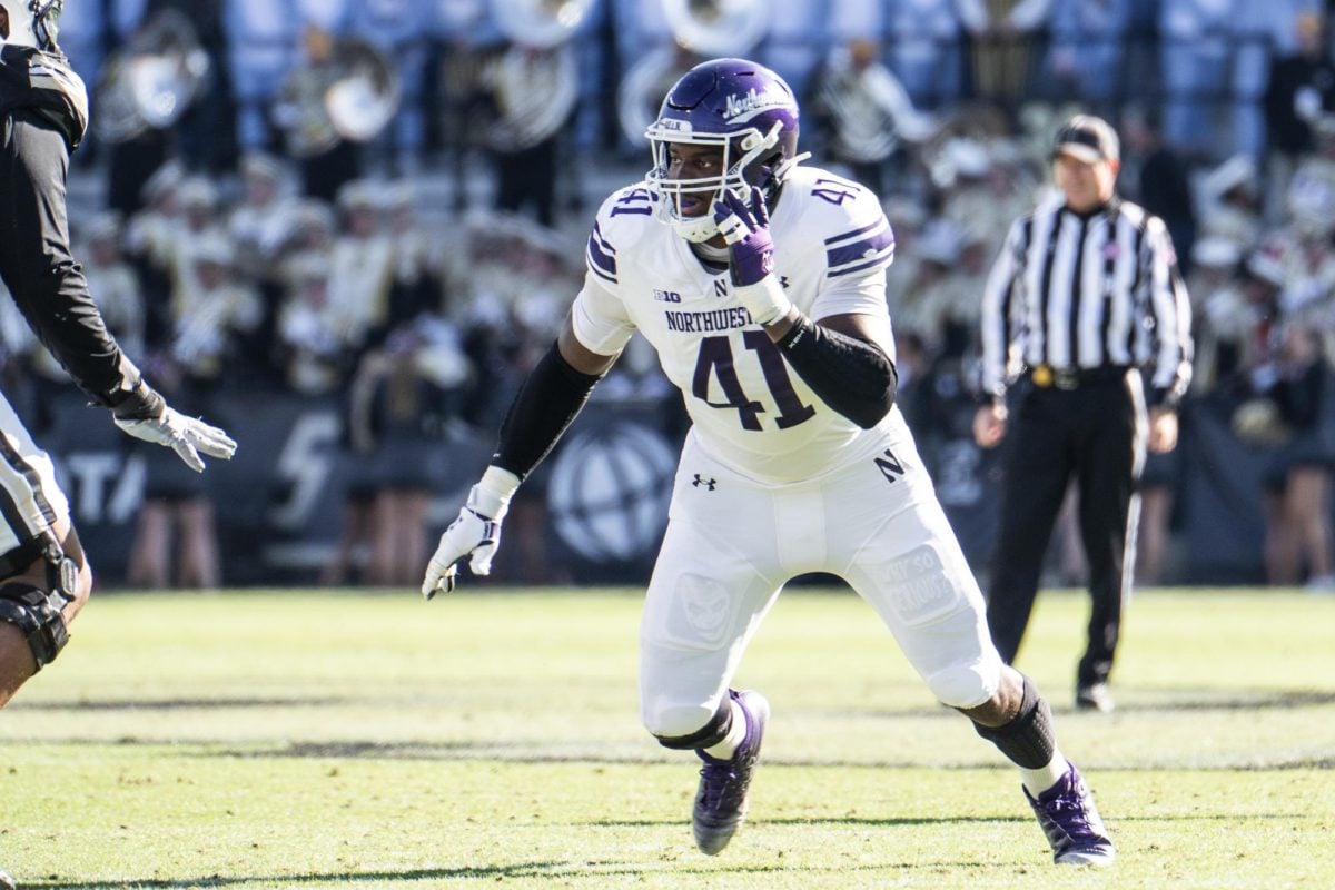 Graduate student defensive end Jaylen Pate rushes off the edge against Purdue Saturday.