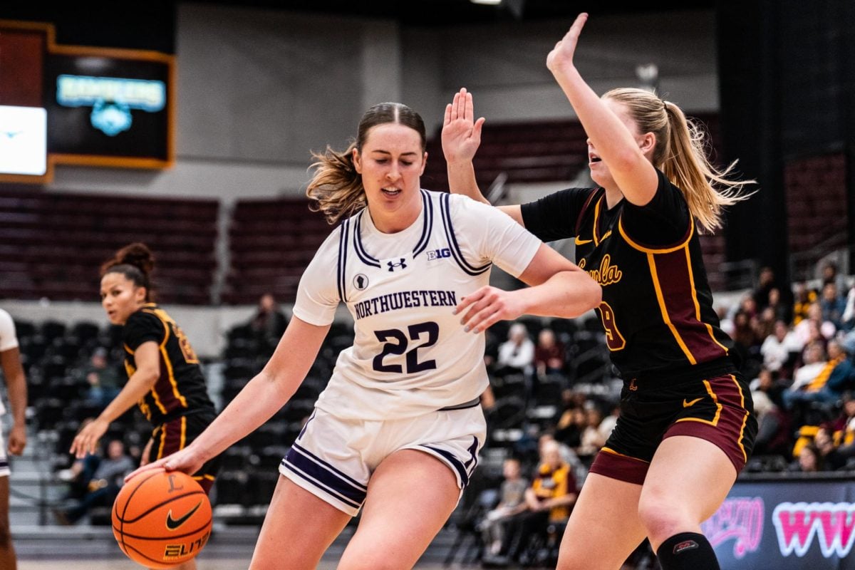 Junior forward Grace Sullivan drives in the paint against Loyola Chicago last week. Sullivan scored 22 points Sunday. 