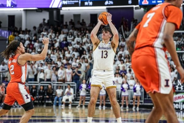 Senior guard Brooks Barnhizer shoots a three-pointer against Illinois earlier this season. Barnhizer notched a double-double Sunday. 