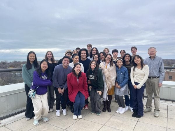 several people pose in a group for a photo