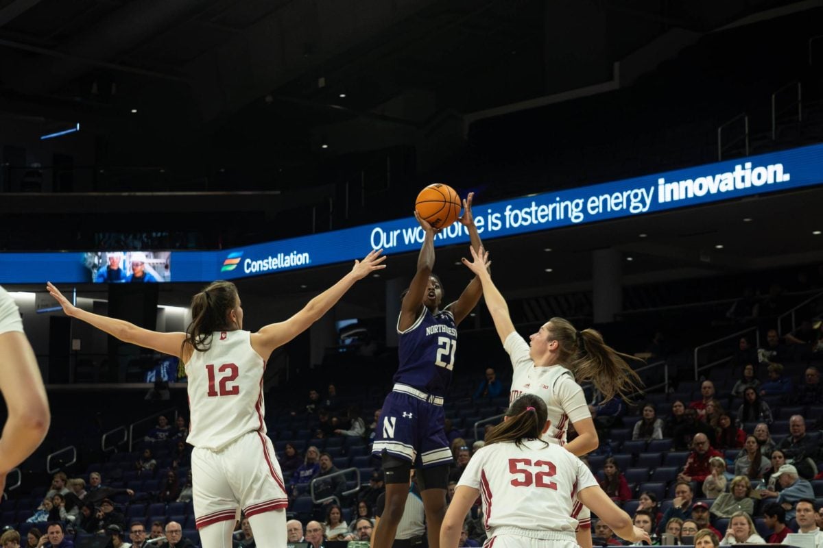 Senior guard Melannie Daley rises for a shot in a crowd of Indiana defenders in Wednesday’s loss. 
