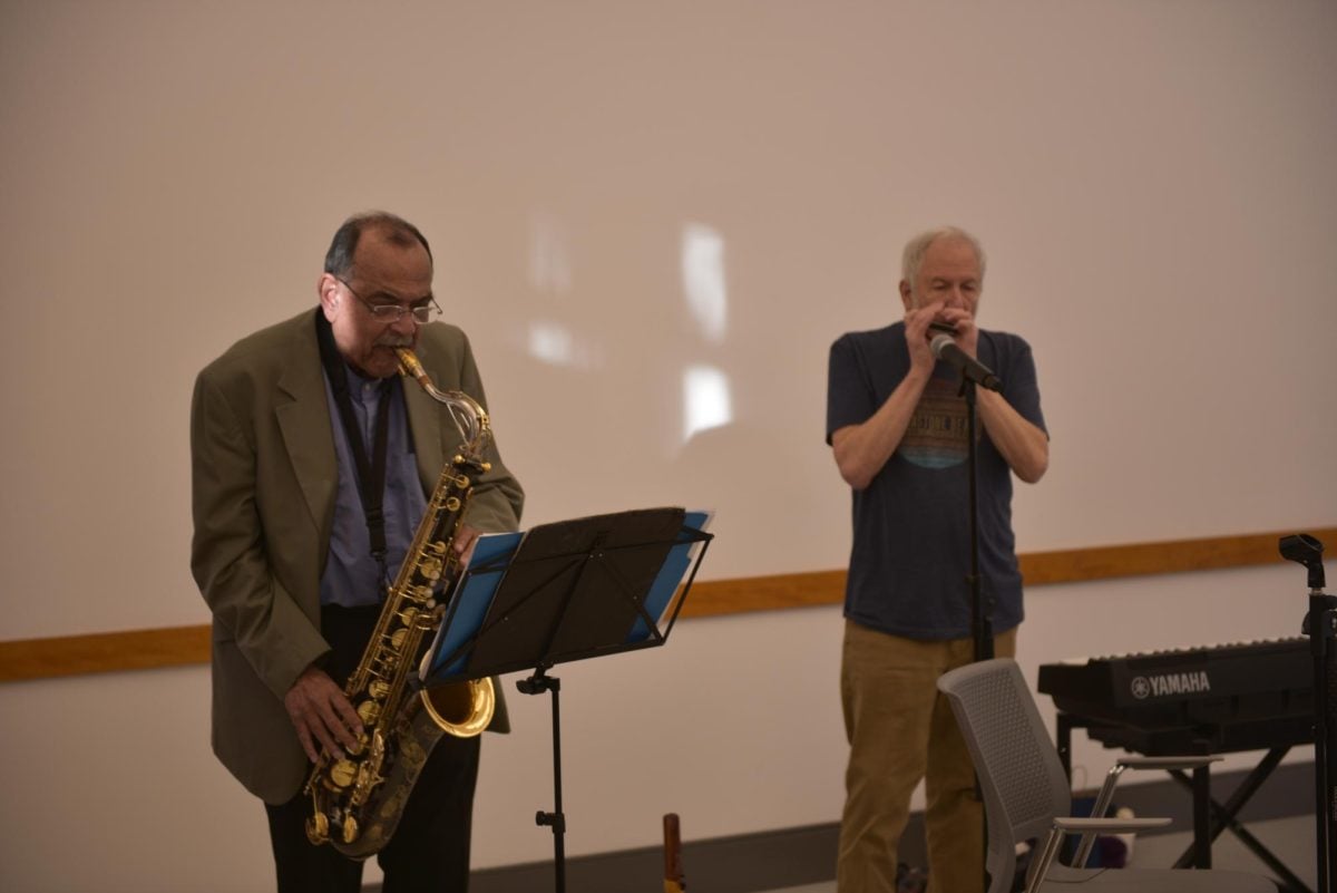 During the lecture, the duo performed original renditions of several songs.