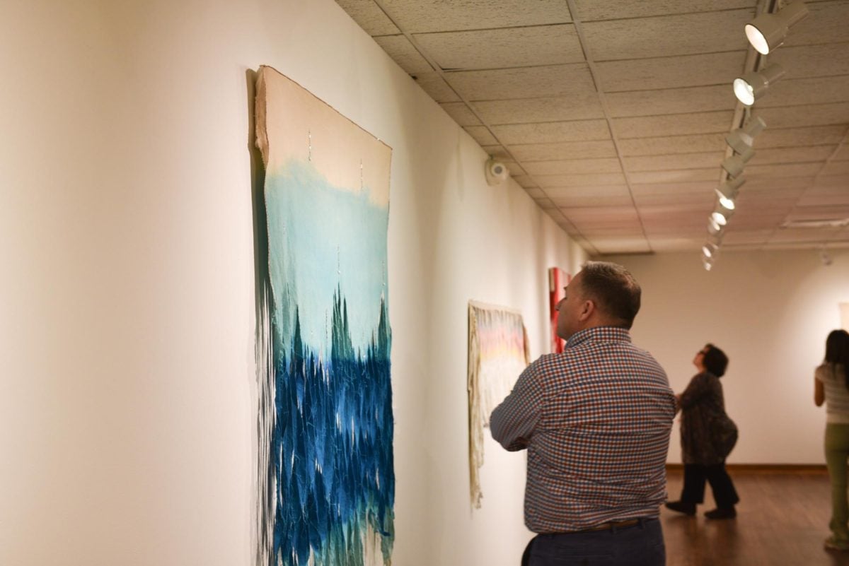 A person observes Bighorn’s “Untitled 1.”