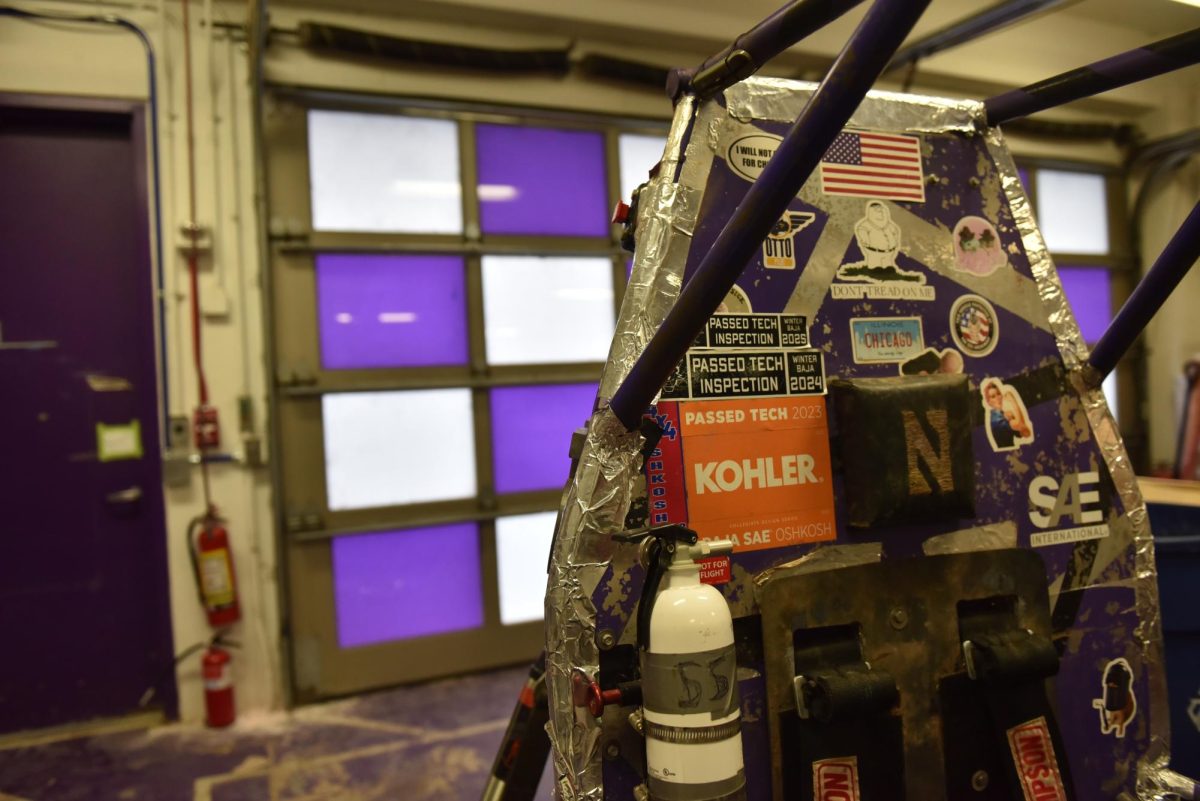 Closeup of the stickers on one of the off-road vehicles. Stickers include the American flag and a Chicago license plate, among others.