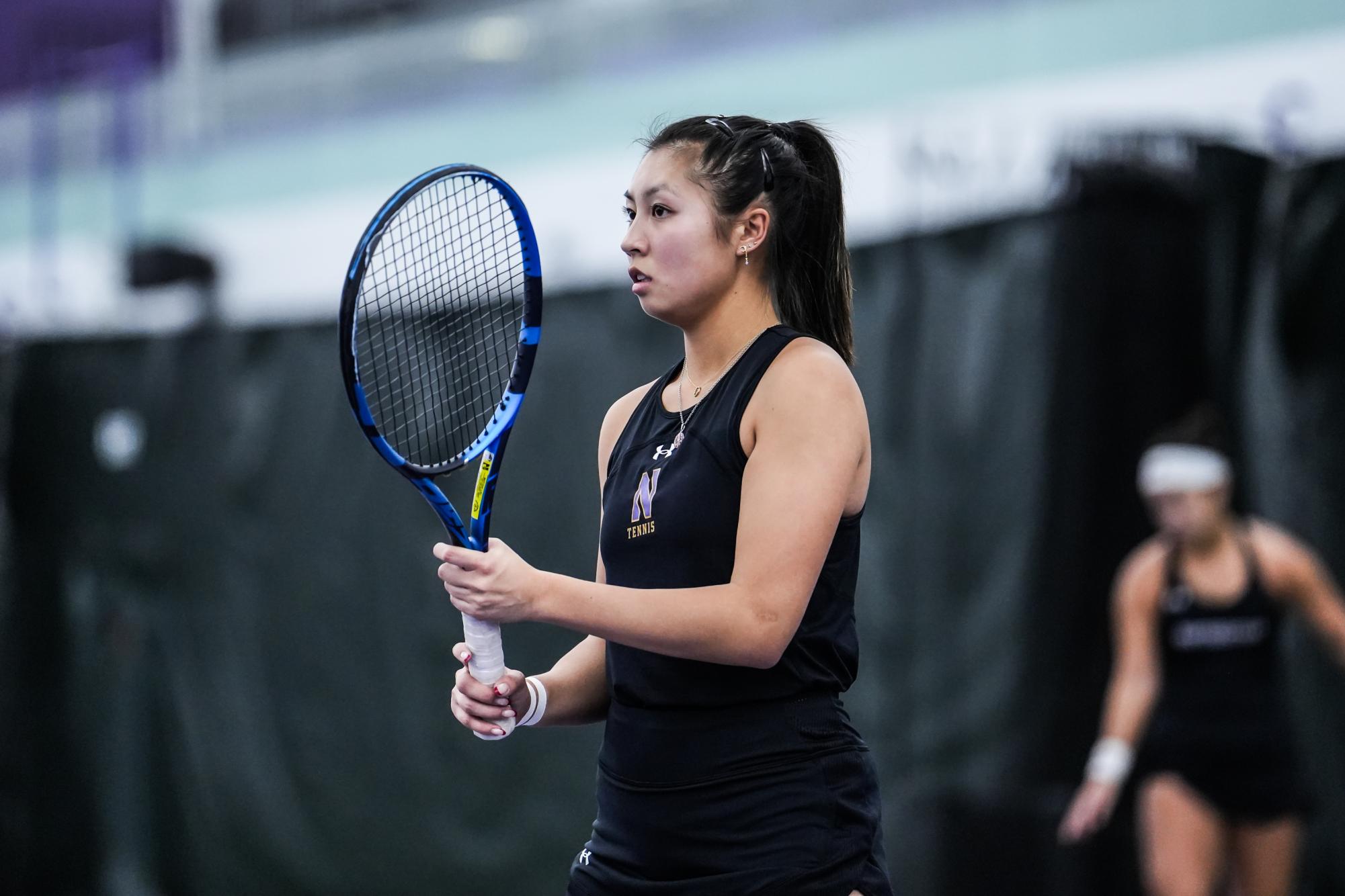 Graduate student Britany Lau readies to return a point against Notre Dame on Jan. 10. 