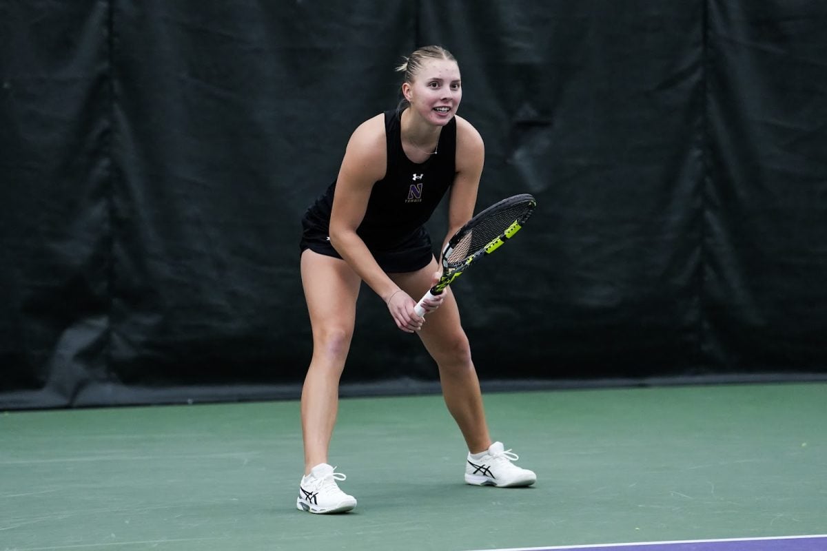 Senior Sydney Pratt prepares to return a serve earlier this season. Pratt’s 6-2, 7-5 singles victory was one of Northwestern’s two points against Illinois on Saturday.