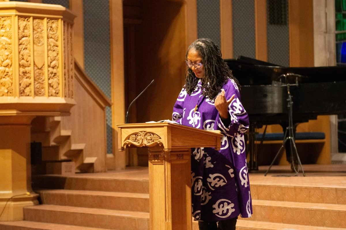 Religious Educator Dr. Karen Mosby leads the chapel welcome at the beginning of the ceremony. 