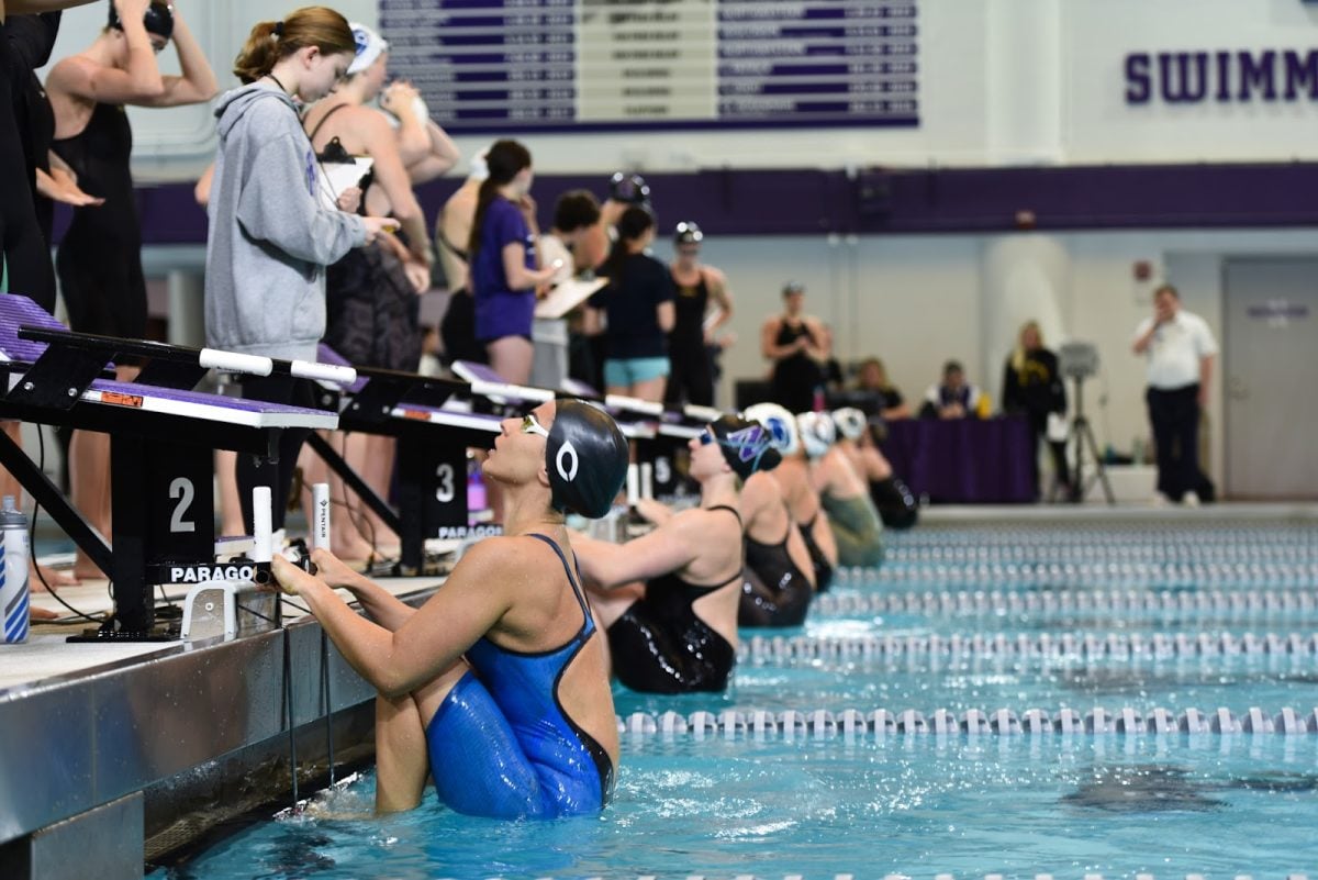 Northwestern swimmers wait for a race to begin earlier this season. 