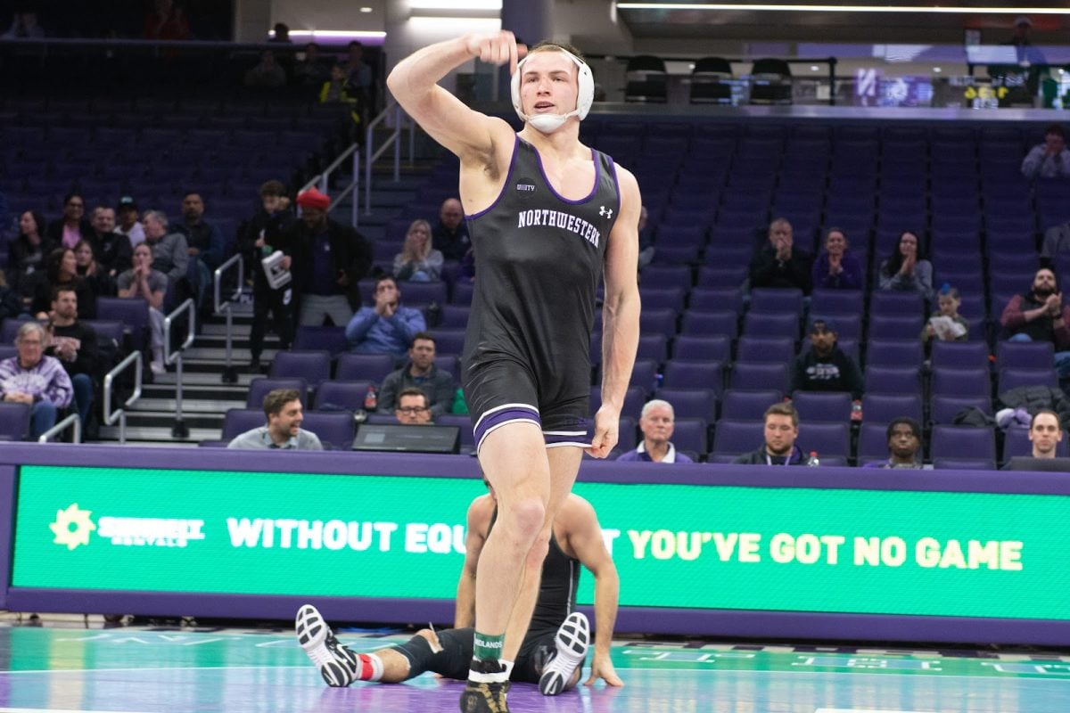 No. 13 redshirt junior 197-pounder Evan Bates celebrates after pinning Michigan State’s No. 25 Remy Cotton.