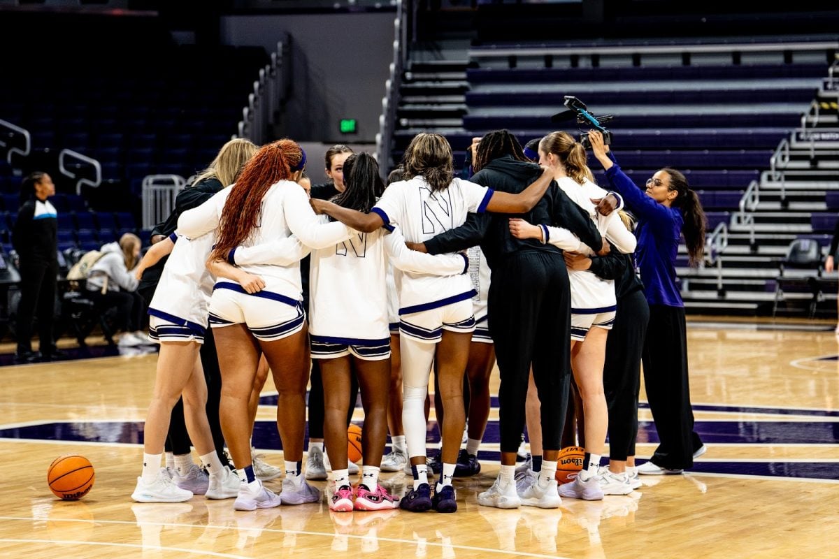 Northwestern huddles during a game earlier this season