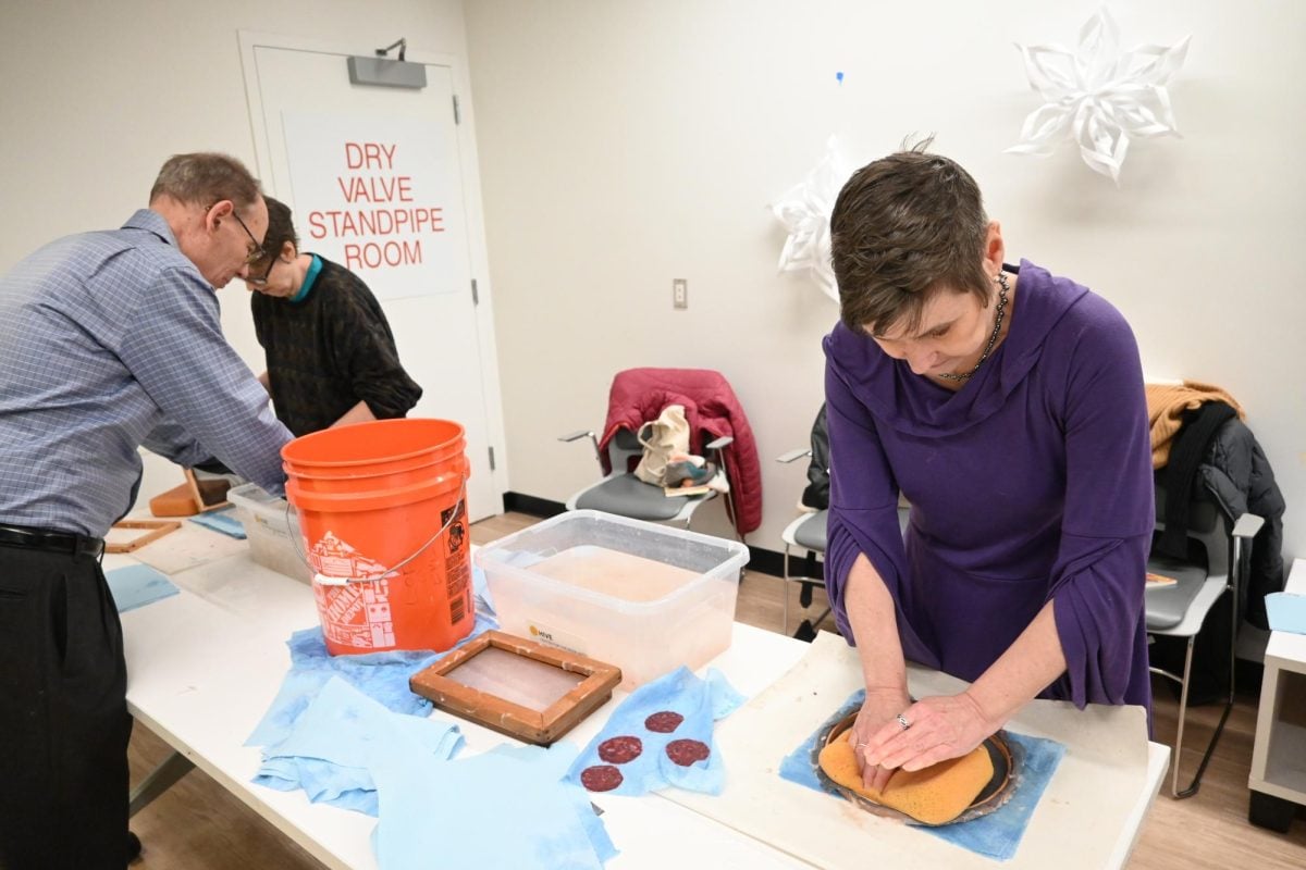 Event attendees learn how to make their own paper during the Hive Center for the Book Arts and Evanston Public Library’s workshop.