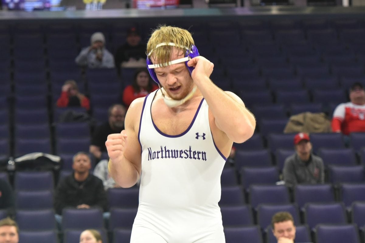 Redshirt freshman 285-pounder Dirk Morley celebrates after a comeback 15-14 win against Wisconsin’s Gannon Rosenfeld.