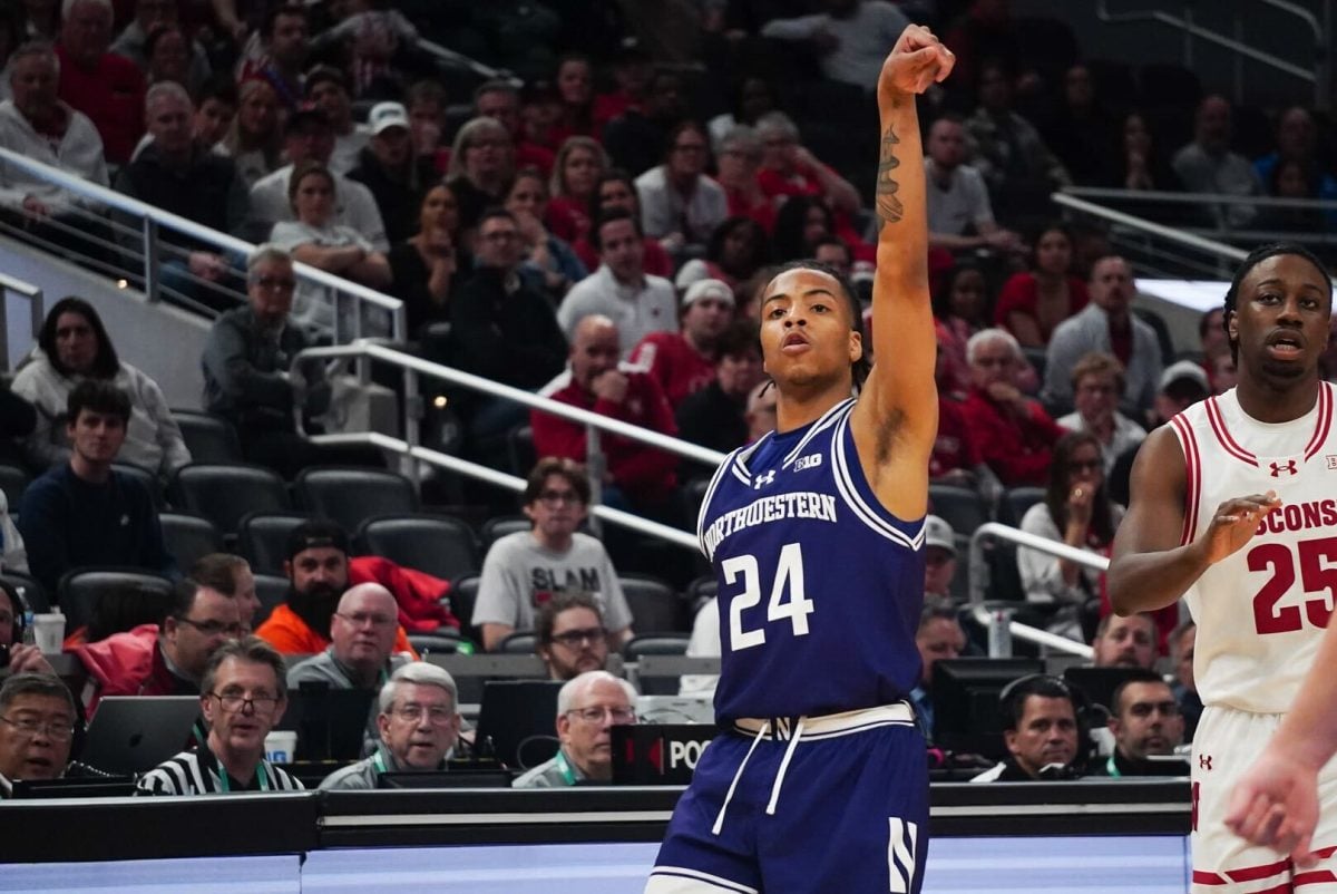 Freshman guard K.J. Windham watches his shot fall in Northwestern's loss to No. 18 Wisconsin in the second round of the Big Ten Tournament Thursday.