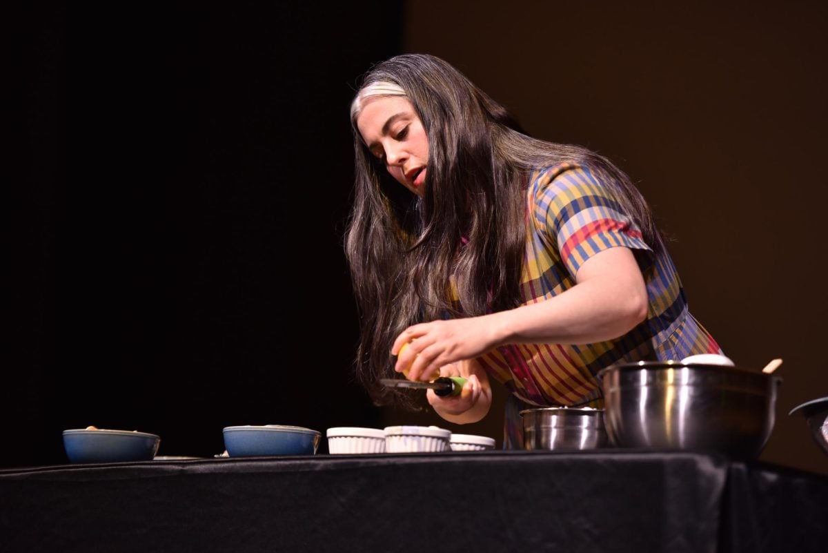 Claire Saffitz zests a lemon onstage.