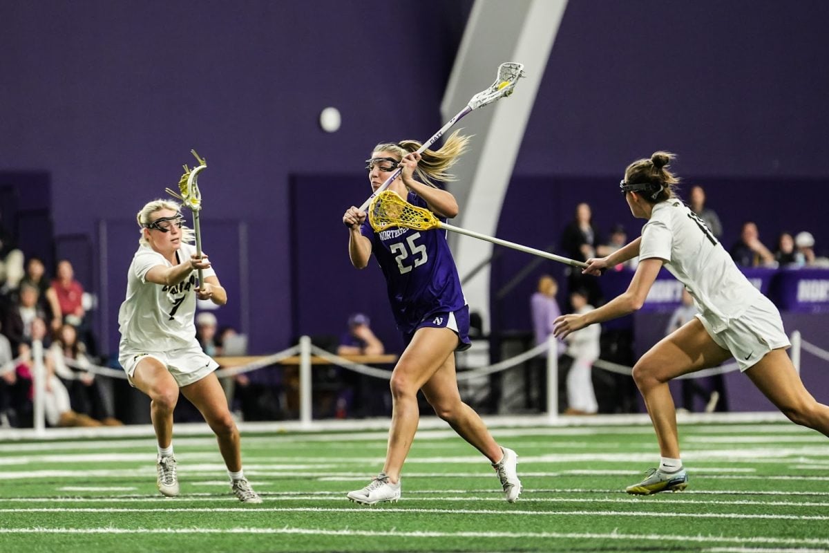 Junior attacker Madison Taylor fires a shot against Colorado Feb. 21. Taylor scored a career-high eight goals against Marquette Friday. 