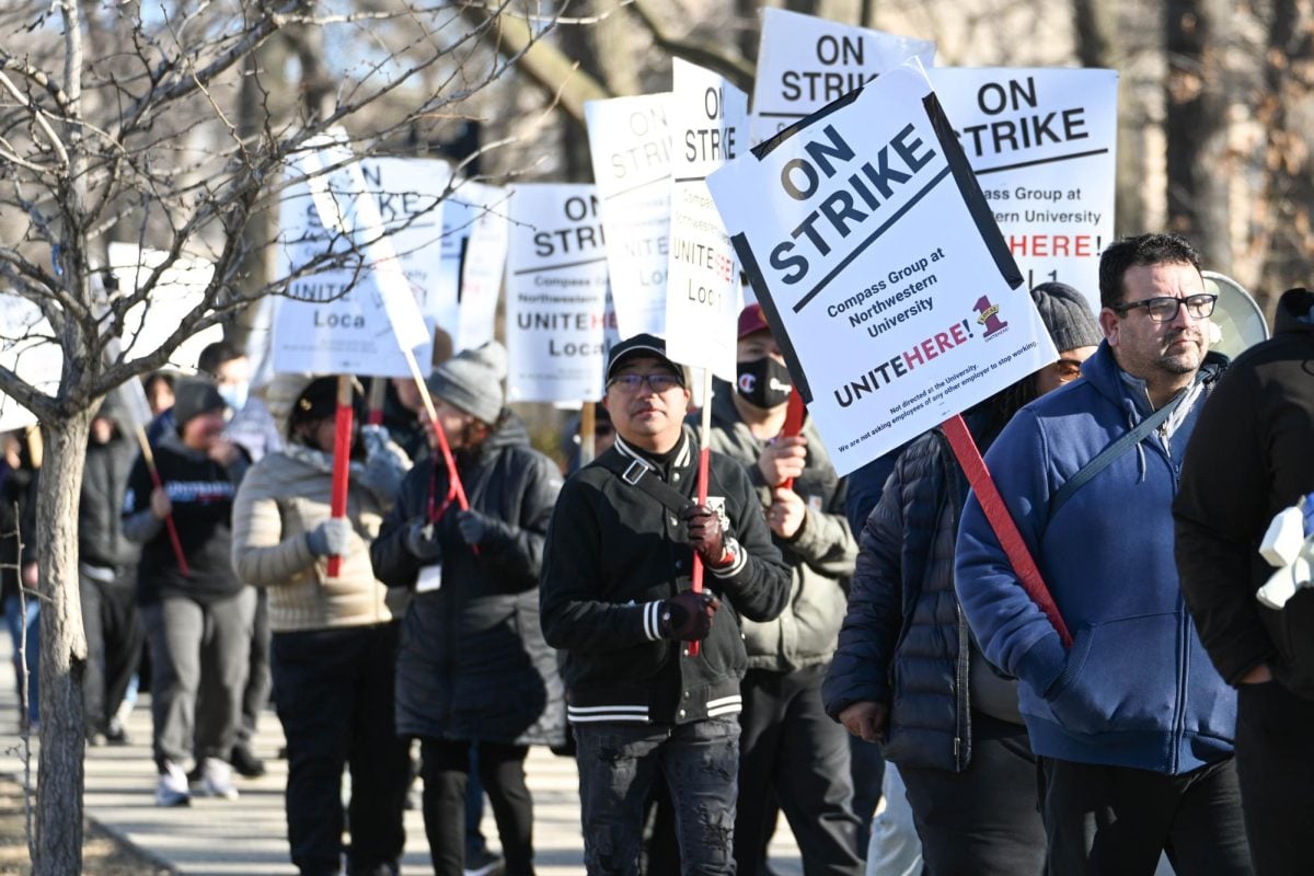 Striking workers gathered outside of every campus dining hall and near the Arch early Monday morning. 
