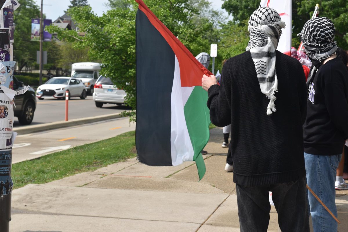 Protesters chanted, “Occupying stolen lands, you have blood on your hands.”