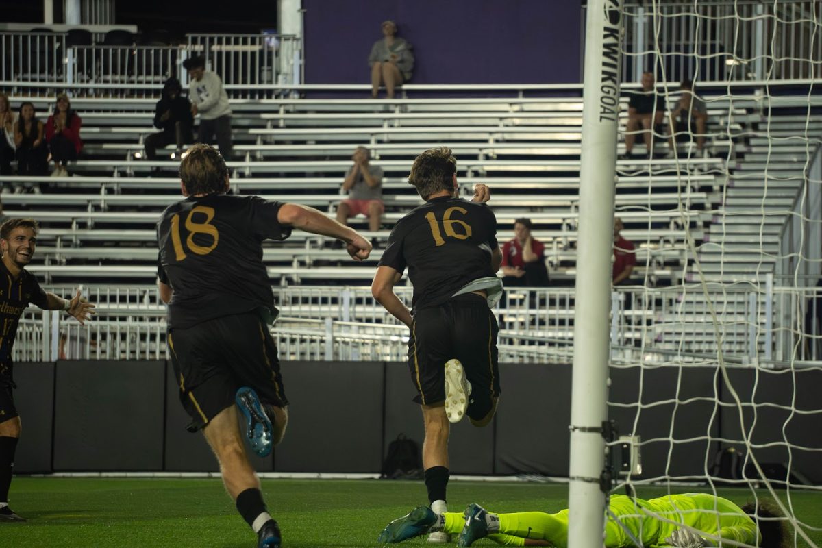 Junior midfielder Peter Riesz celebrates after scoring his first of two goals during Thursday’s win.