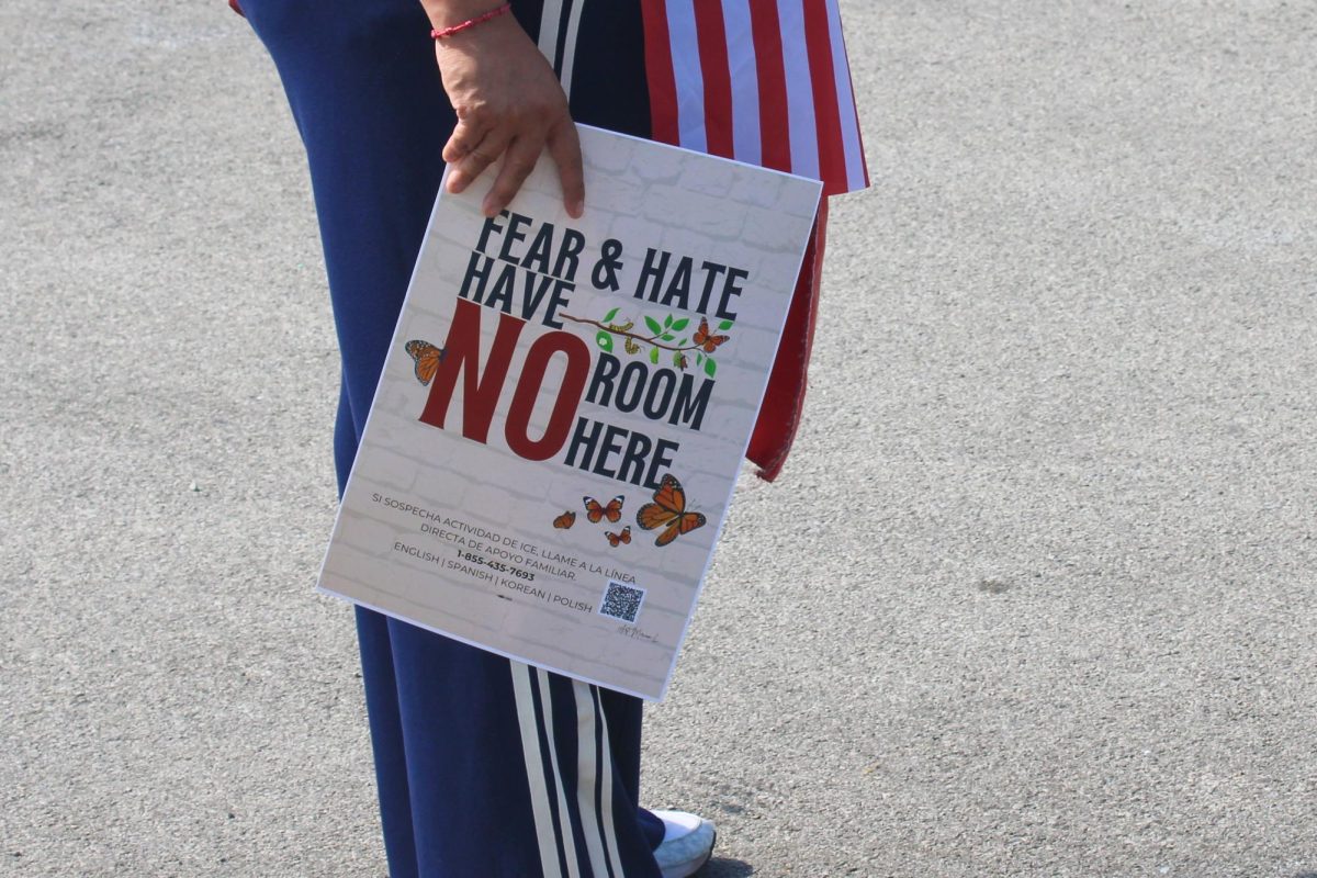 A protester holds a sign. 