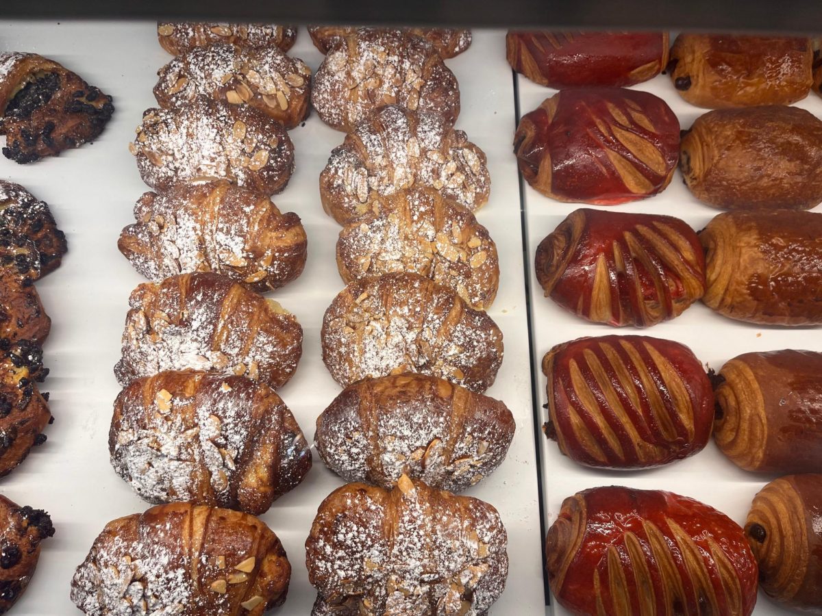 Three croissant variants are lined along a display case.