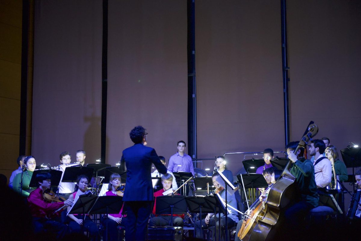The Contemporary Music Ensemble bathed in partial darkness as they performed “in vain” on Saturday.