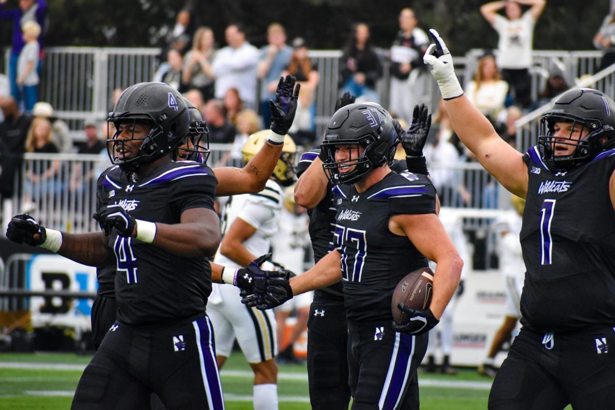 Northwestern players celebrate during their first shutout victory since 2017.