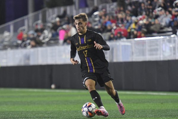 Senior forward Alejandro Martinez Santamaria dribbles up the pitch in the Oct. 31 win against Indiana.