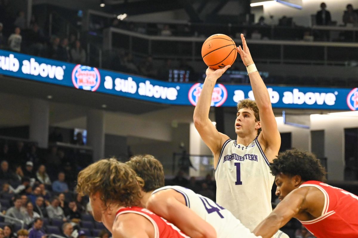 A basketball player prepares to shoot a free throw.