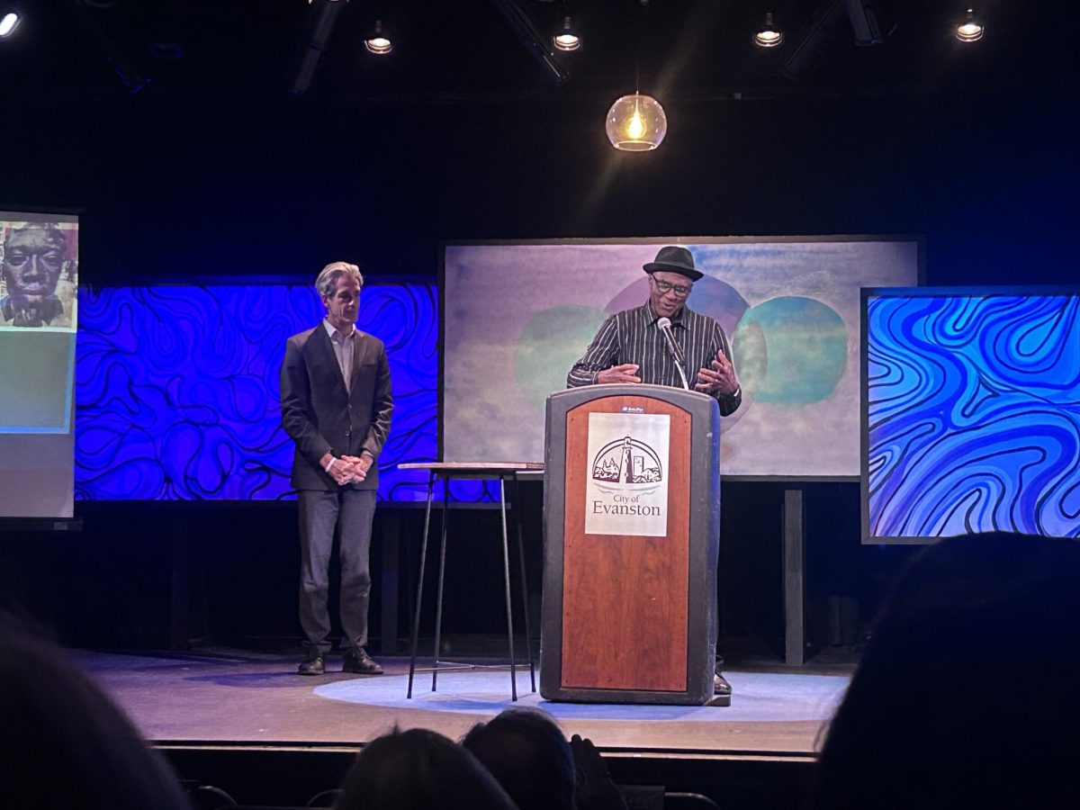 Jazz guitarist and business owner Donovan Mixon accepts his Mayor’s Award for the Arts, presented by Daniel Biss.