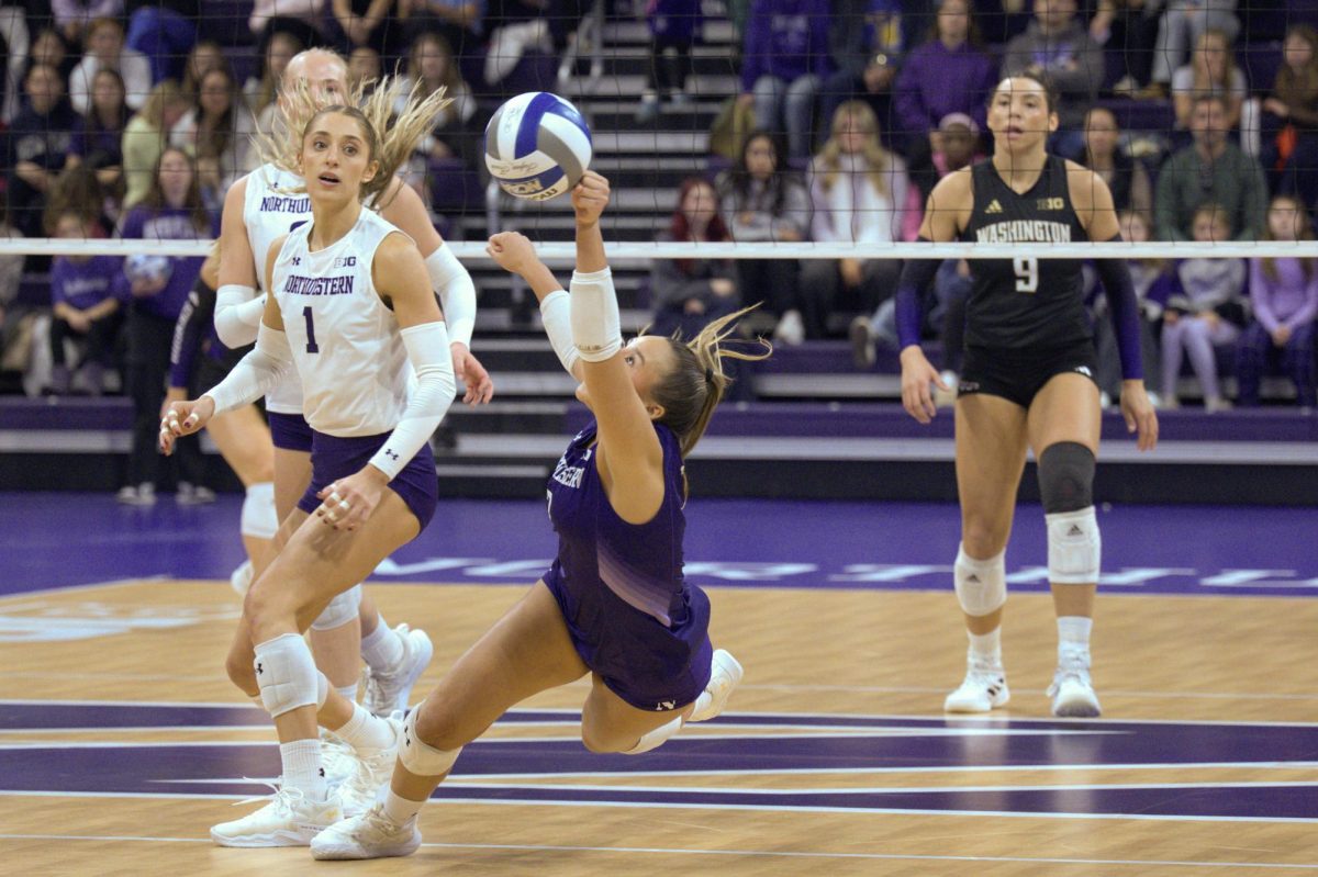 Lauren Dignan nearly hits the ground while diving for the ball.