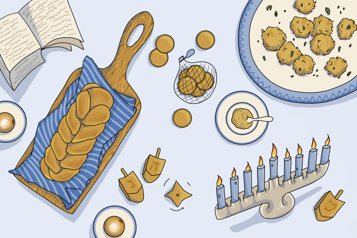 Hanukkah menorah, latkes, gelt and challah on a blue table