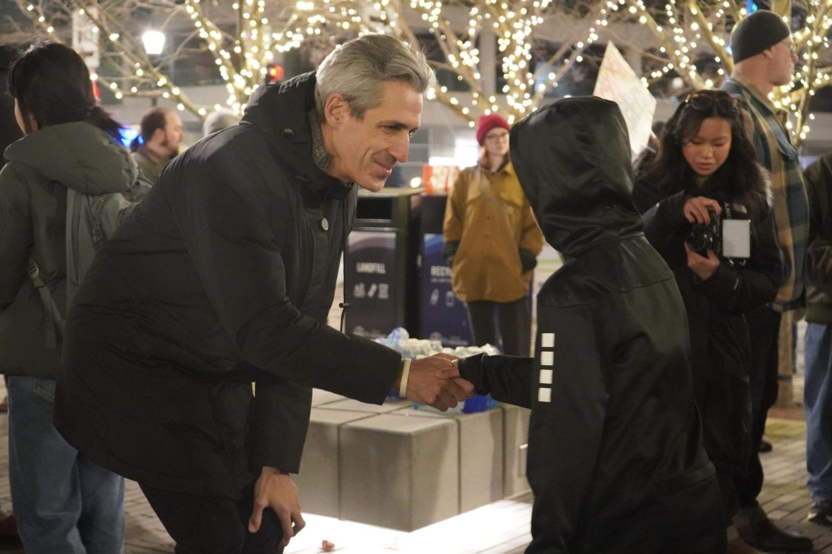 (A person bends over to shake another person&rsquo;s hand.)