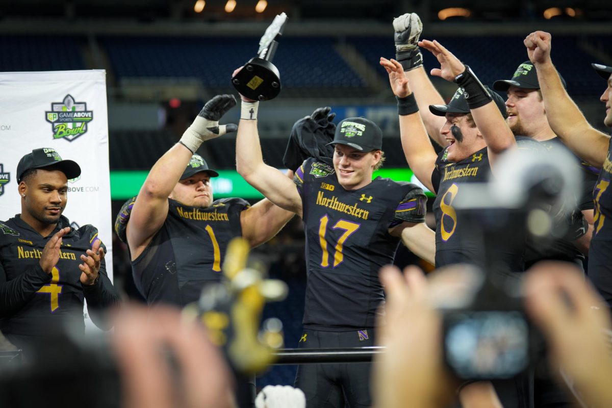 Junior receiver Griffin Wilde hoists the GameAbove Sports Bowl’s Most Valuable Player trophy.
