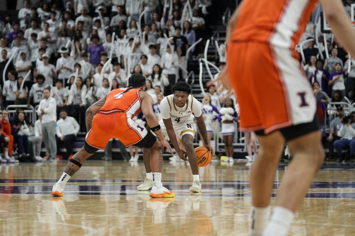 A player in a white jersey with the ball surveys the floor.