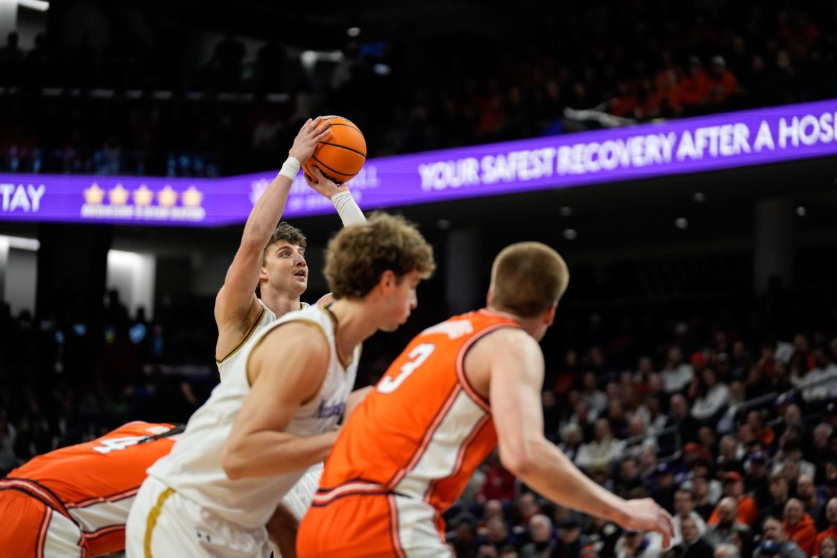 A basketball player prepares to make a free throw.