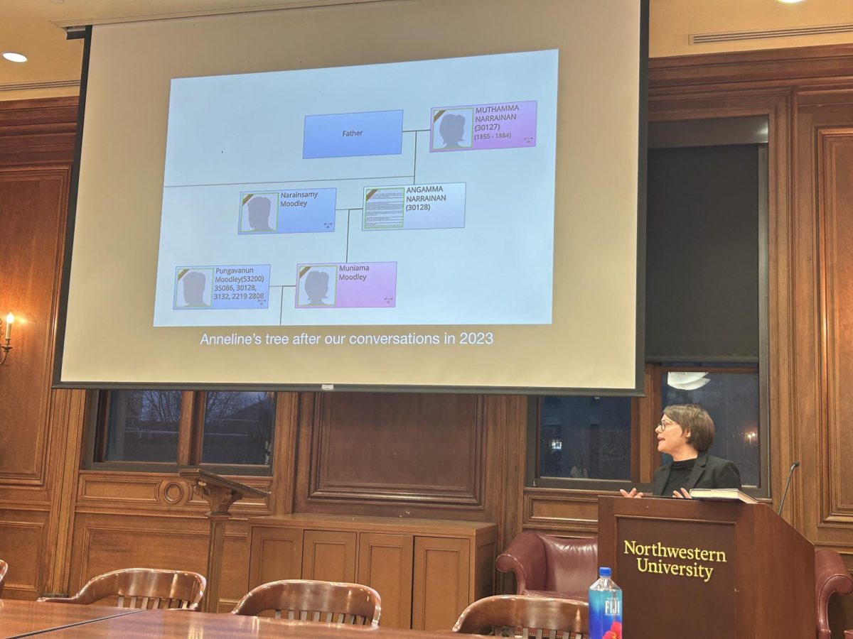 A woman presents a slideshow at a podium