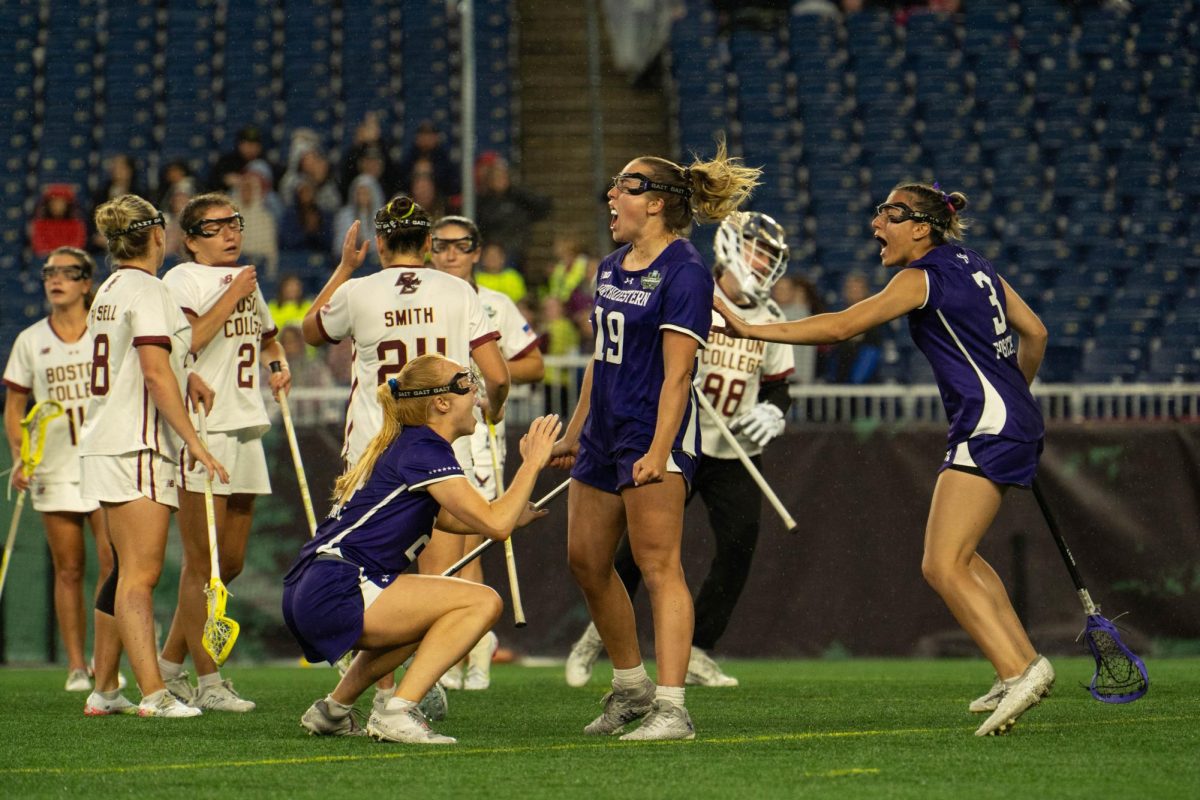 Northwestern players celebrate after senior midfielder Sam Smith’s lead-taking goal during last season’s semifinal win over Boston College. The Wildcats open their season with a rematch against the Eagles on Friday.