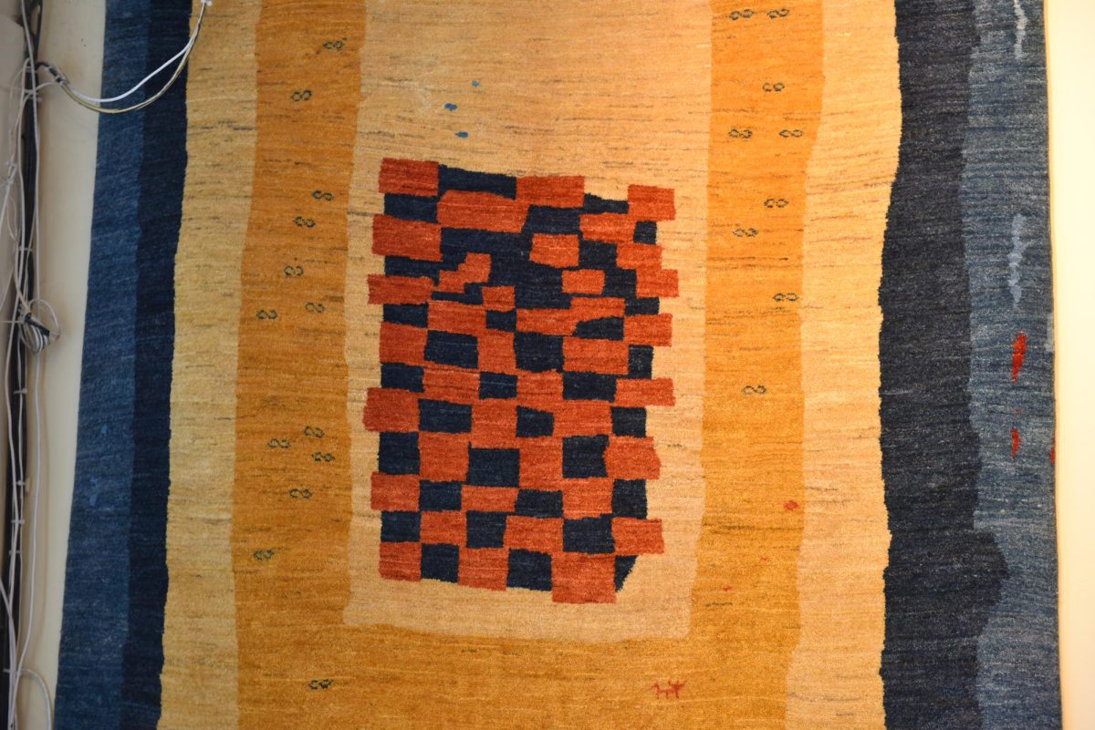 Zoomed-in photo of the design of a rug.