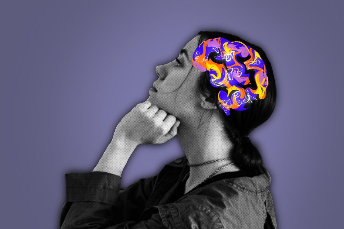 Woman sits sideways with cartoon brain.