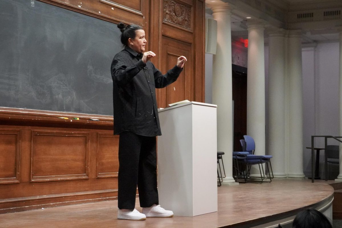 A person stands on a stage.