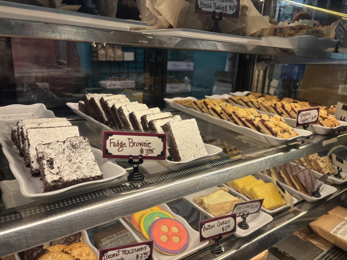 A variety of pastry selections in a case, including brownies, cookies and cakes.