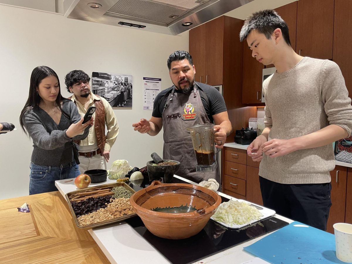 Chef Rodriguez talking with students