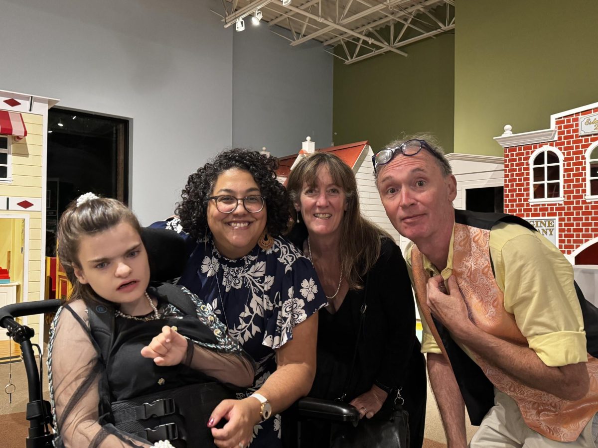 Four people smiling for a photo