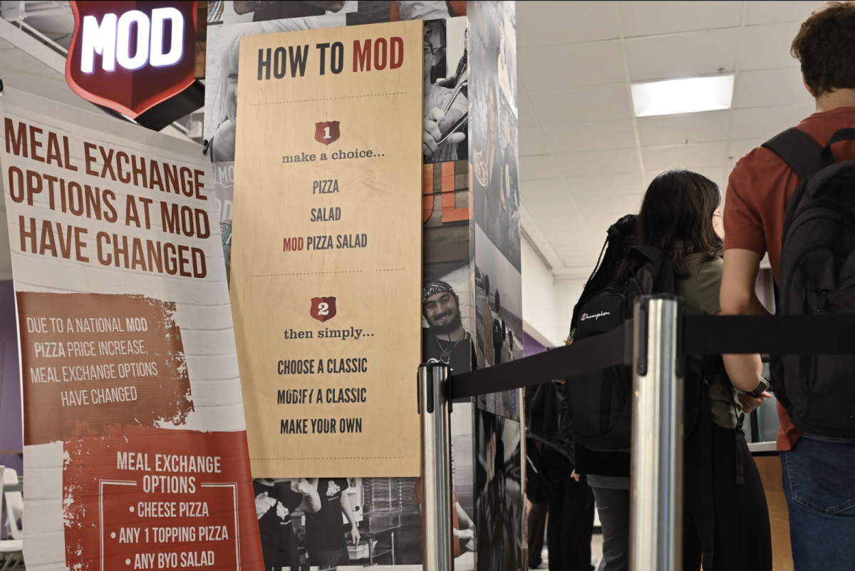 A MOD’s sign above a menu showing how to order.