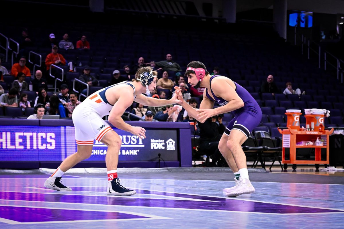 Two wrestlers face each other.