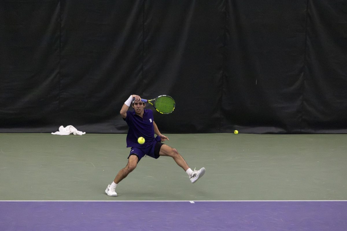 Junior Cyrus Mahjoob hits a forehead during.a match earlier this season. The transfer has won six singles matches this season. 